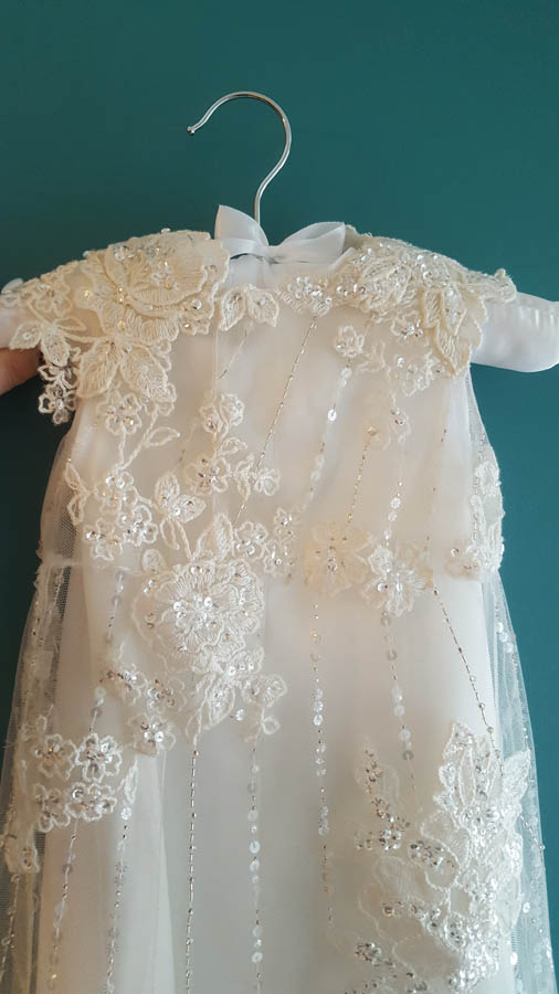 front of toris christening gown